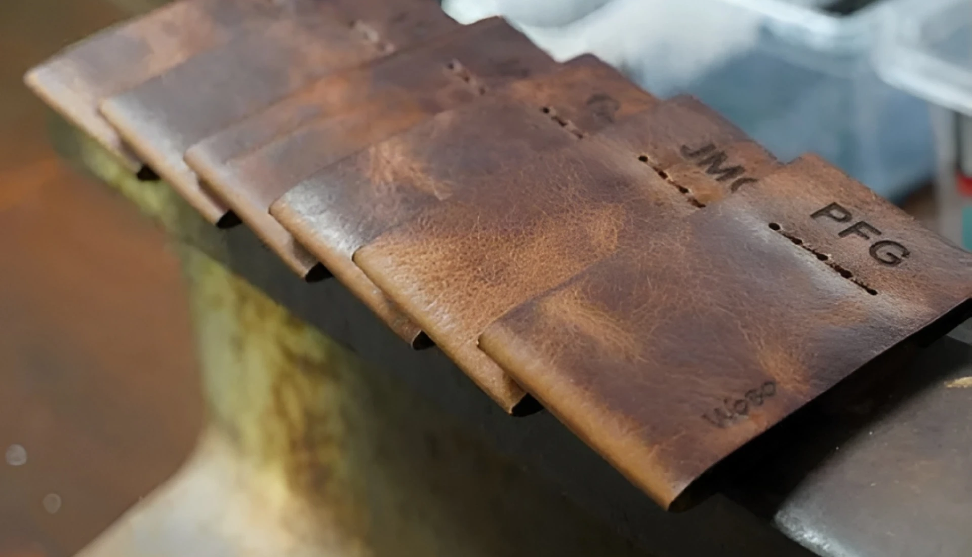 Leather wallets with initials on display