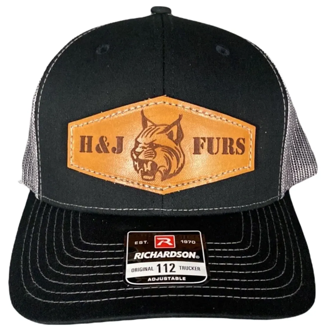 Mesh trucker hat with leather patch