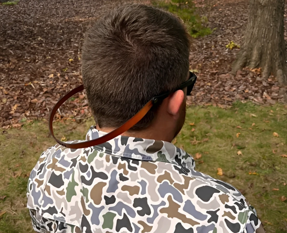 Man in camo shirt outdoors